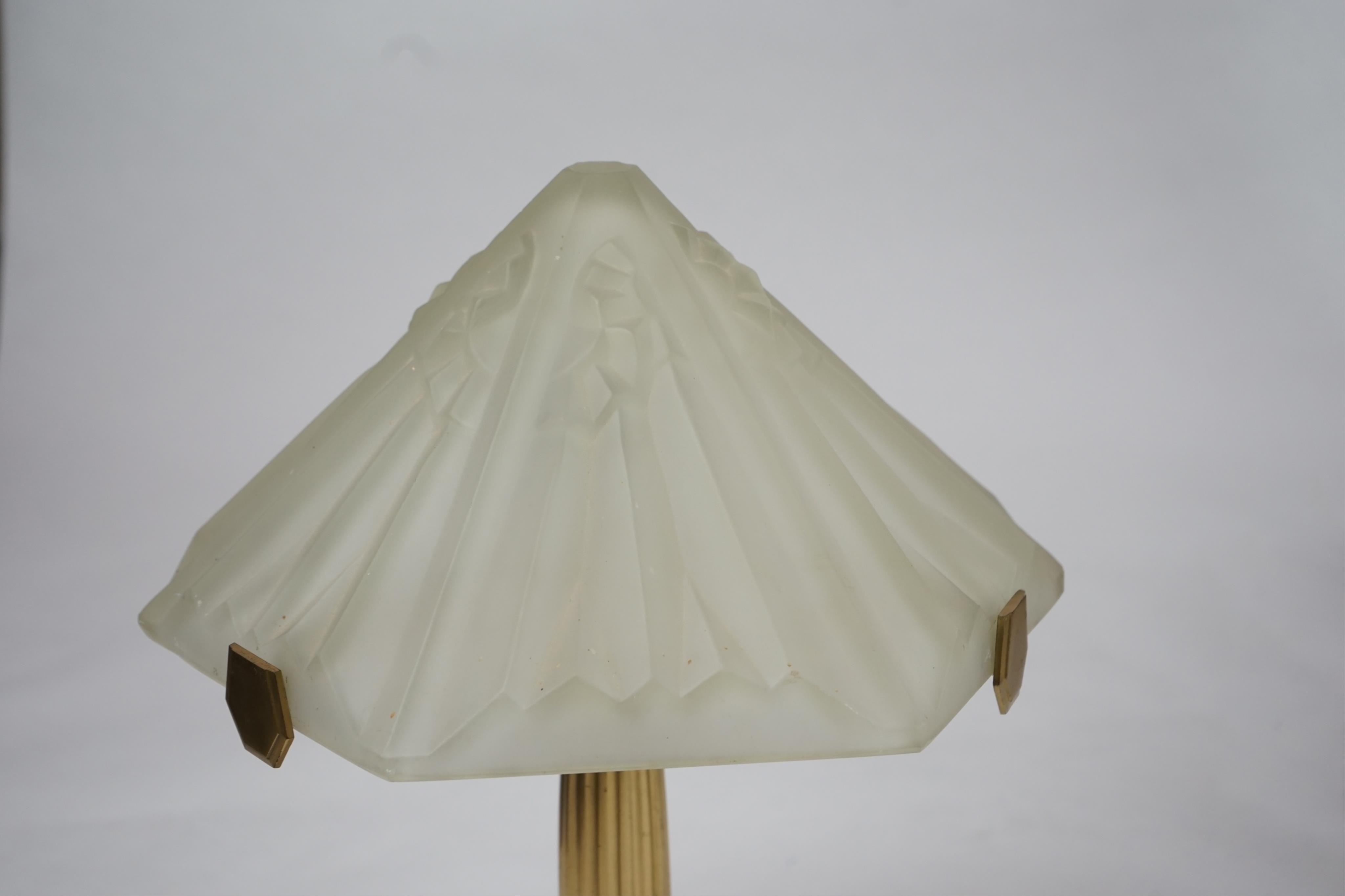 An Art Deco matt gilt brass table lamp with frosted glass shade